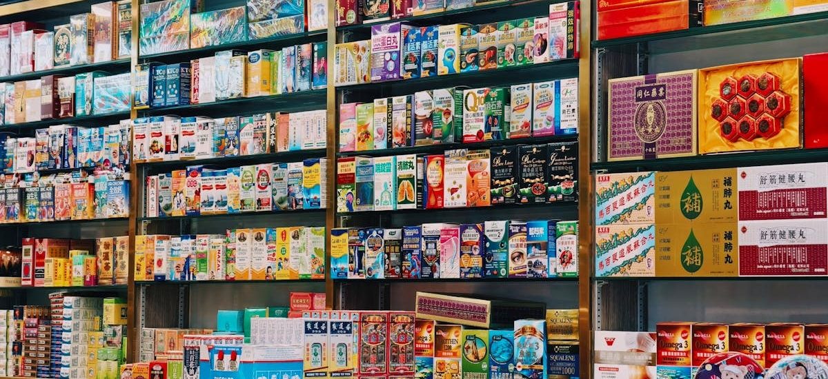 Bright and colorful display of various Asian products on supermarket shelves.